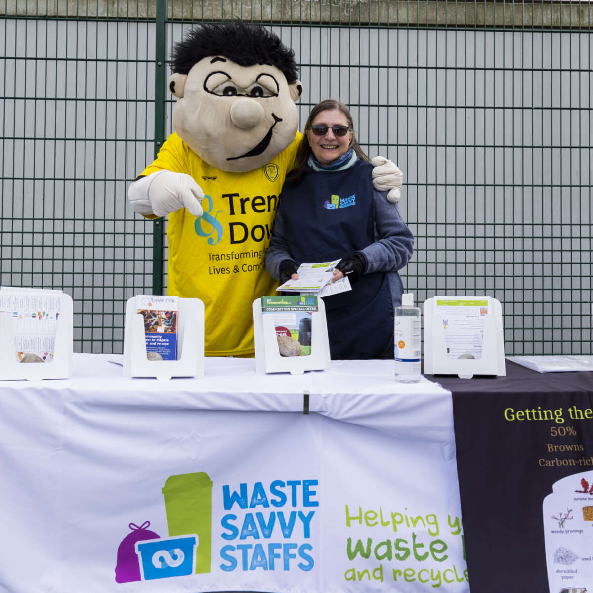 Master Composters stand at a football game