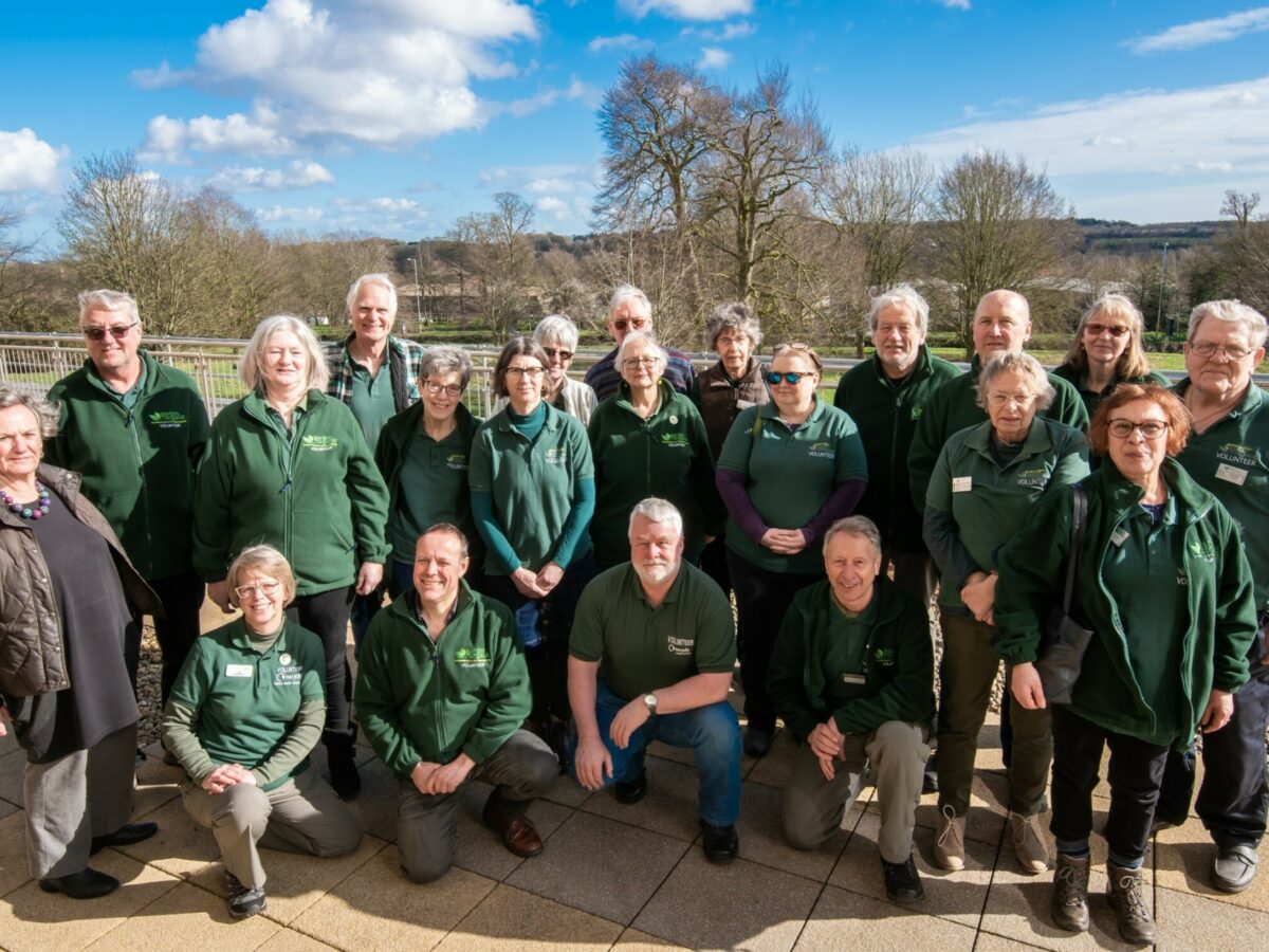 Master Composters stood smiling in Garden Organic Uniform